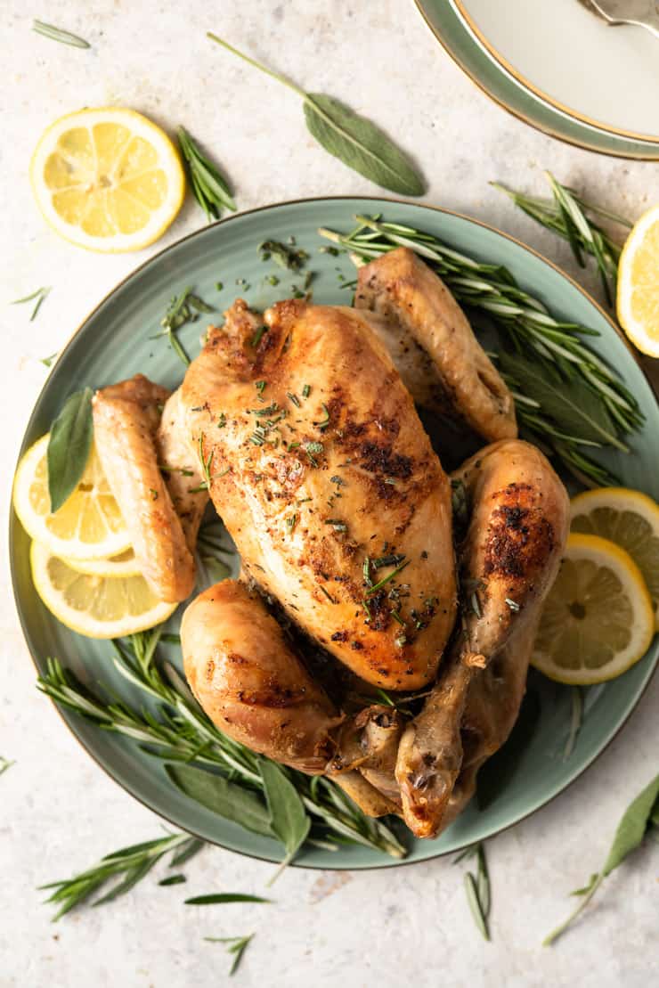 An overhead shot of a whole herb roasted chicken