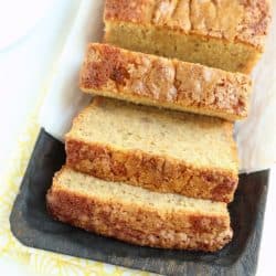 loaf of banana bread sliced on serving tray