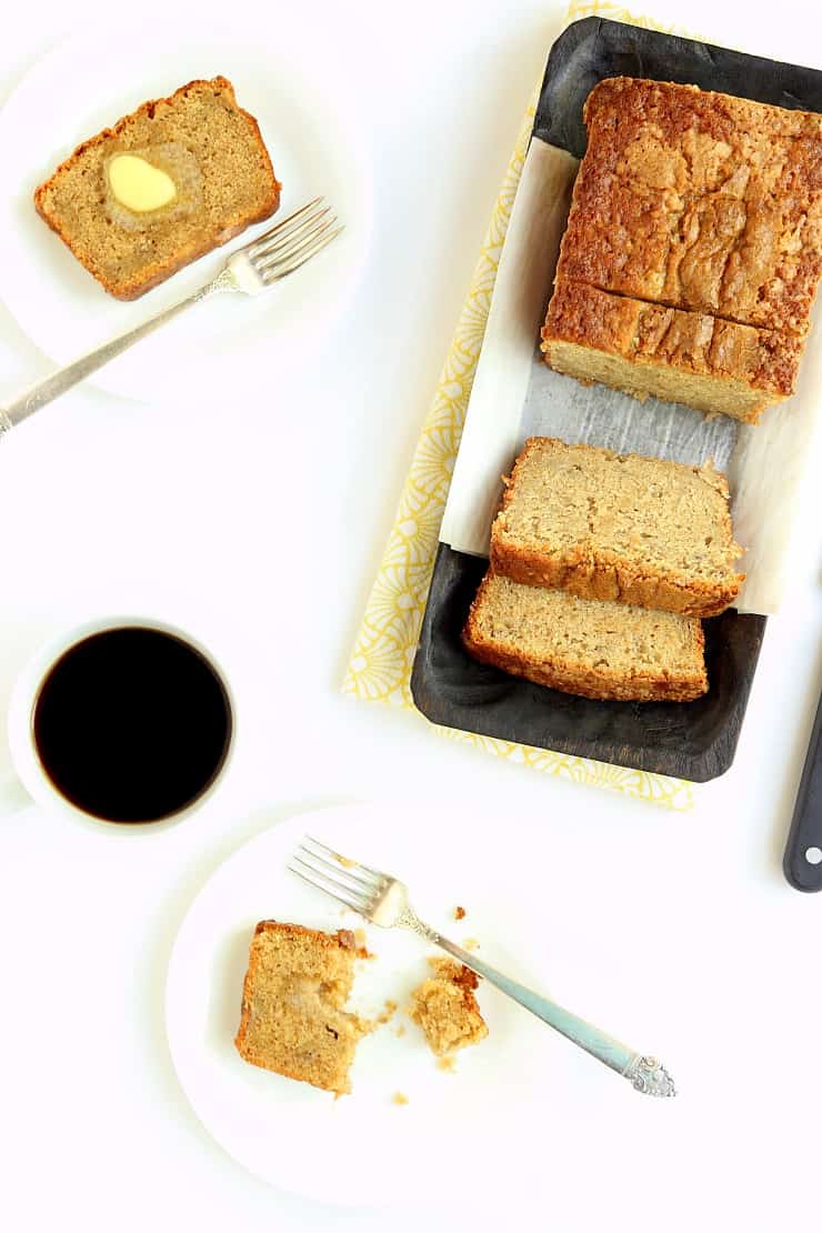 overhead view of sliced banana bread on plates with coffee