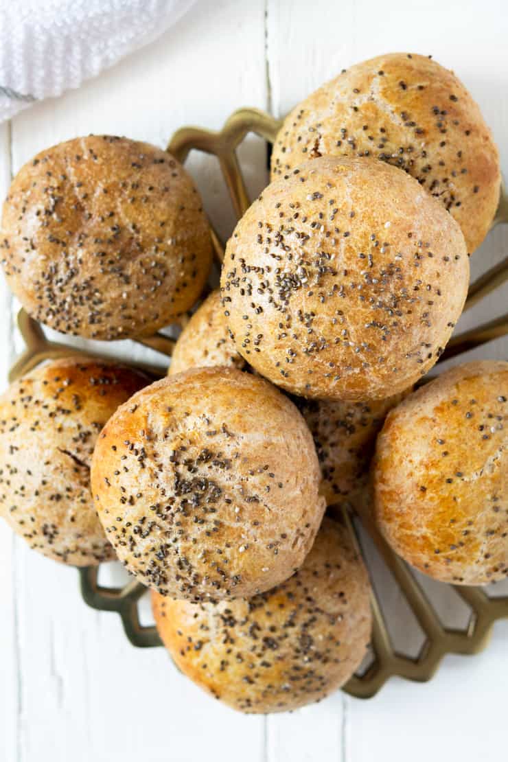 An overhead shot of homemade hamburger buns stacked on top of each other