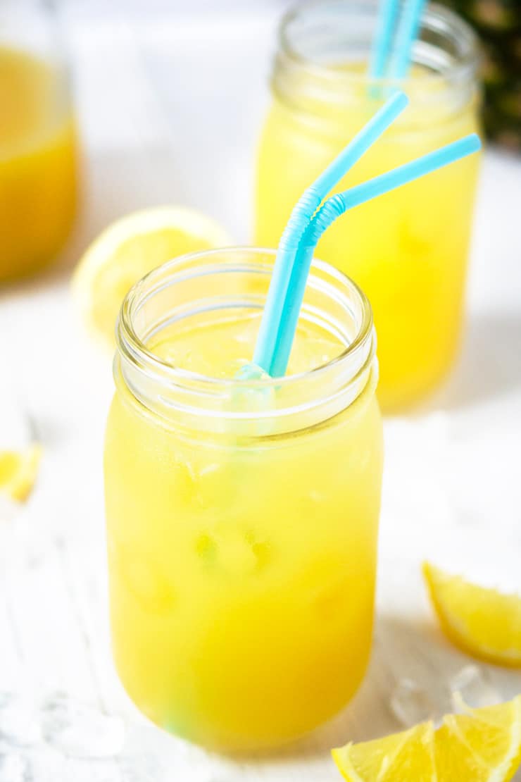 Close up of a mason jar filled with natural pineapple lemonade