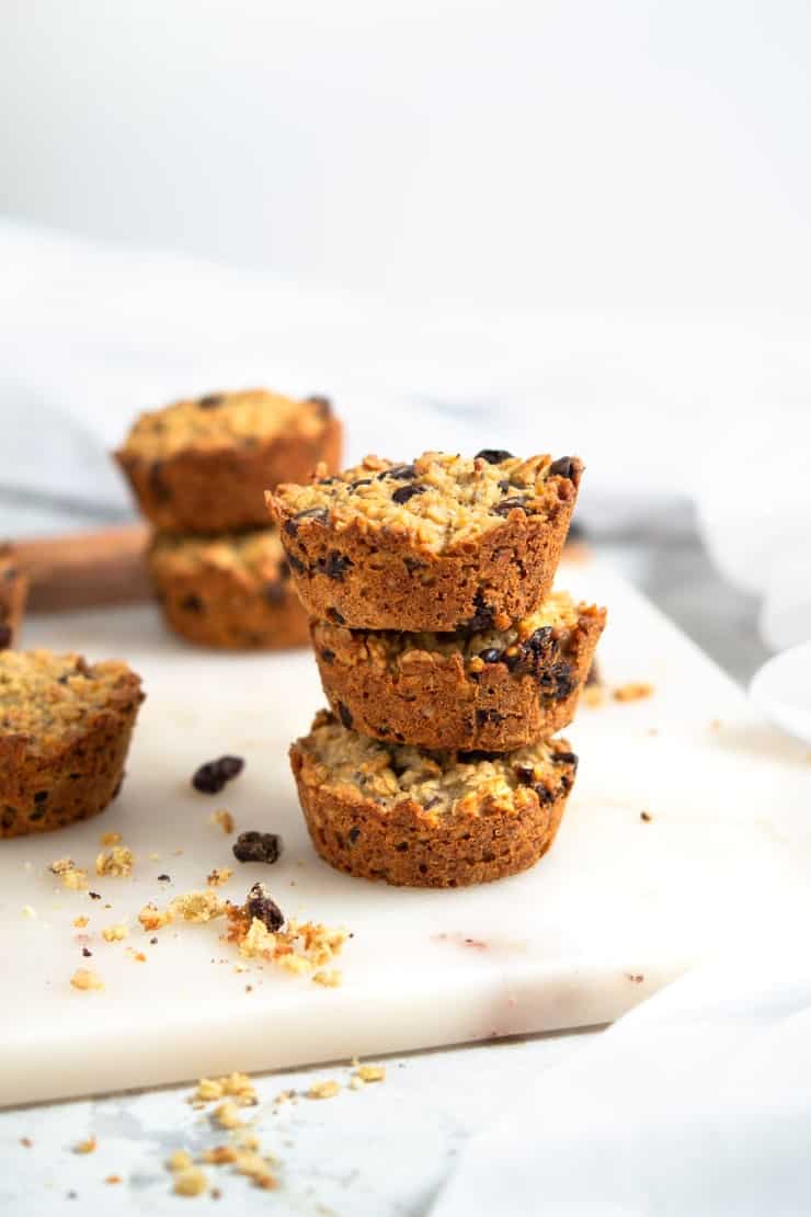 Oatmeal raisin breakfast cookies stacked on top of each other sitting on a marble surface