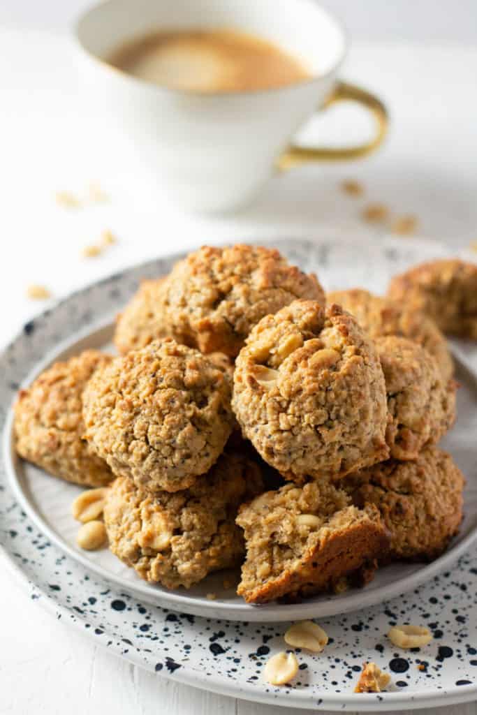A white plate with a pile of peanut butter oatmeal breakfast cookies