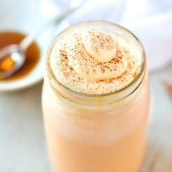 front overhead view of 2 minute pumpkin spice milk in glass with whipped cream and pumpkin pie spice