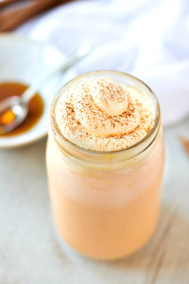 front overhead view of 2 minute pumpkin spice milk in glass with whipped cream and pumpkin pie spice