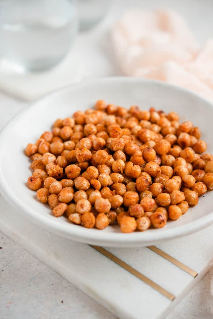 A side shot of pan fried chickpeas in a bowl