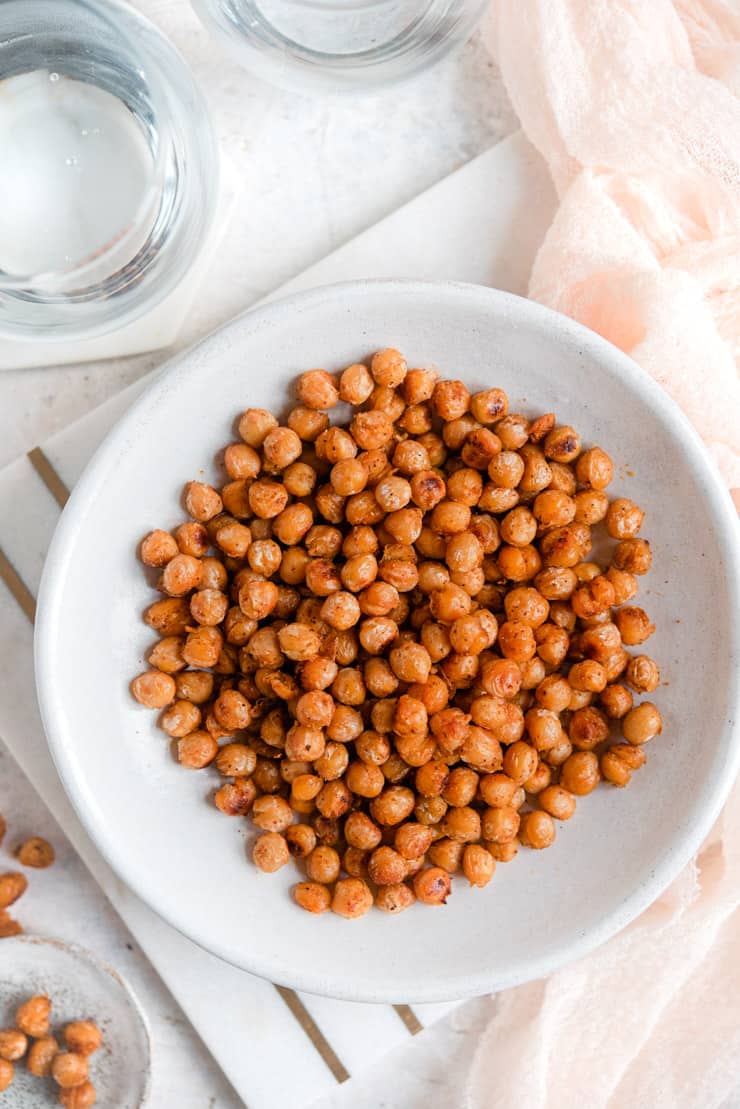 An overhead shot of pan fried chickpeas in a bowl