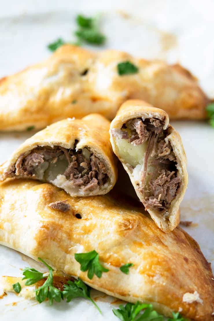 Beef and potato hand pies cut in half