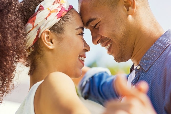 Close up of happy couple dancing outdoors