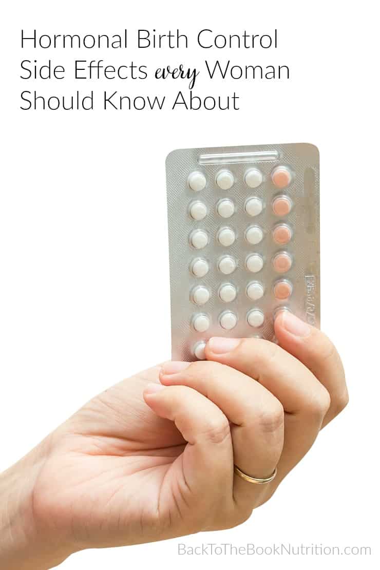 pack of birth control pills in woman's hand