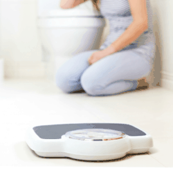 Collage with image of young woman on bathroom floor near scale and title text "7 Common Myths About Eating Disorders"