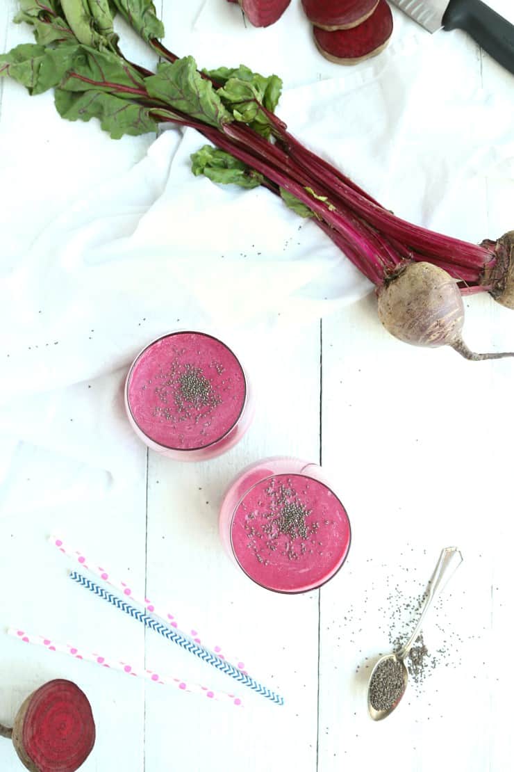 overhead view of strawberry beet smoothie with fresh beets and chia seeds 