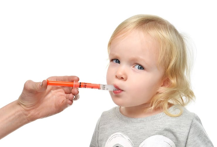 picture of toddler taking antibiotics