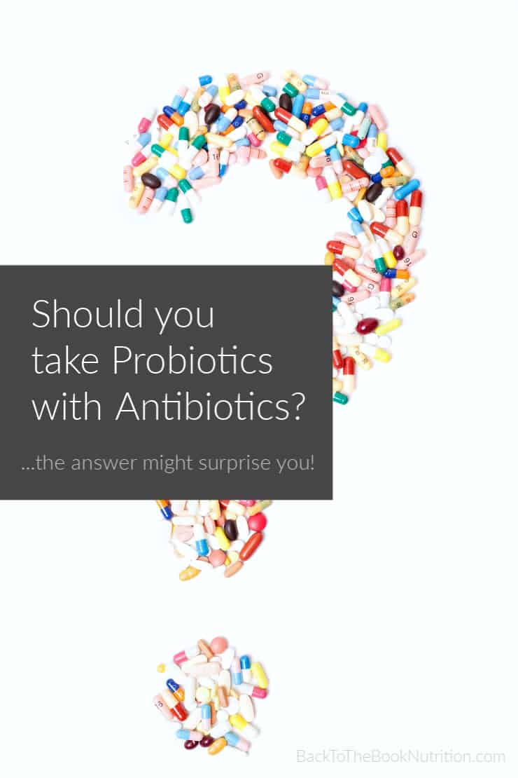 pills in the shape of a question mark with text overlay - should you take probiotics with antibiotics?