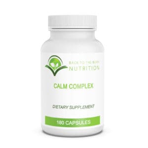 bottle of Calm Complex capsules on white background