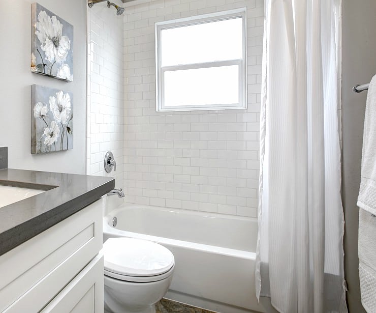 Image of bathroom with white tile and gray accents