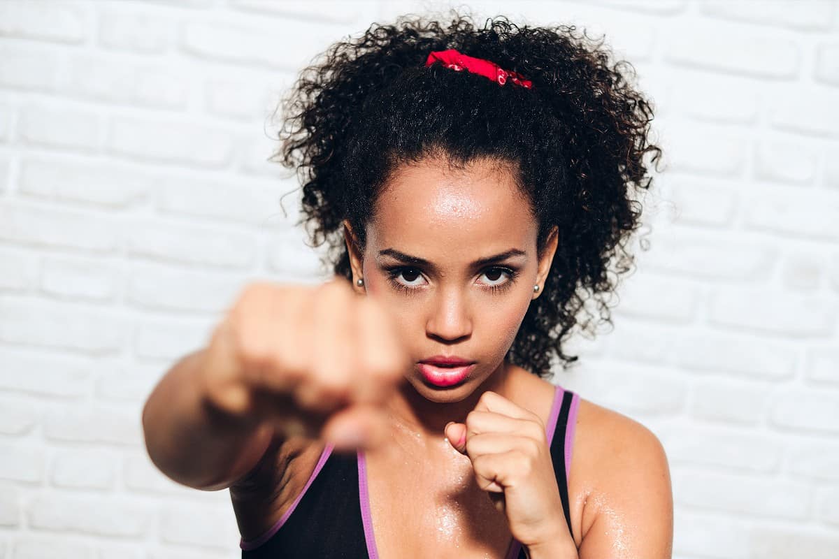 Black woman doing kickboxing workout