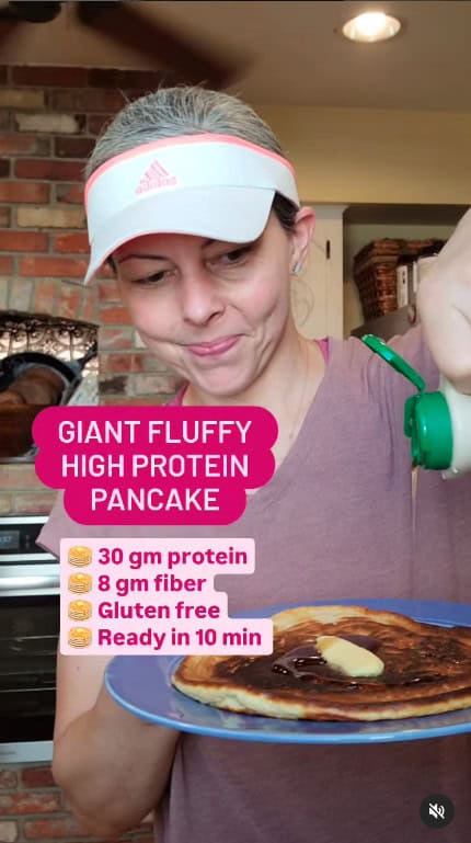 Pouring maple syrup over high protein pancake