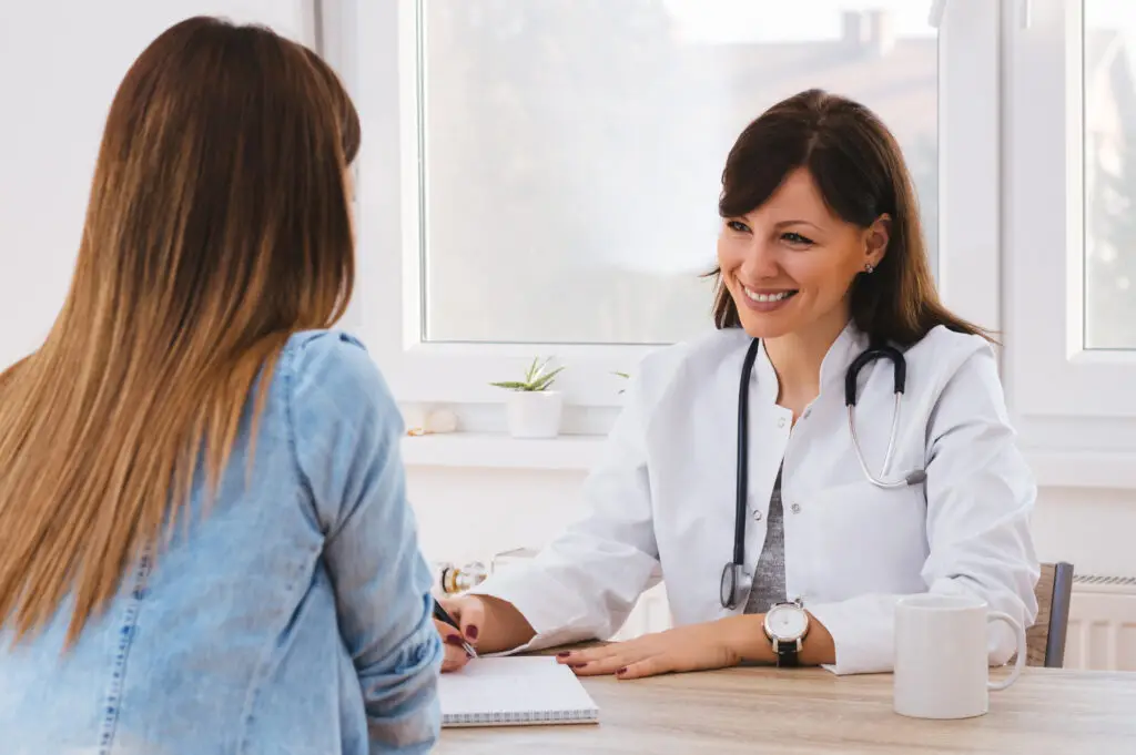 Perimenopause woman discussing lab tests with her doctor